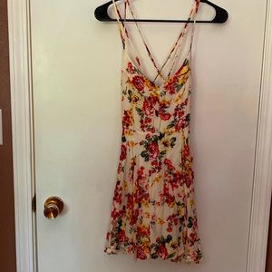 Floral dress used as a swimsuit cover up. Straps are adjustable. Size small